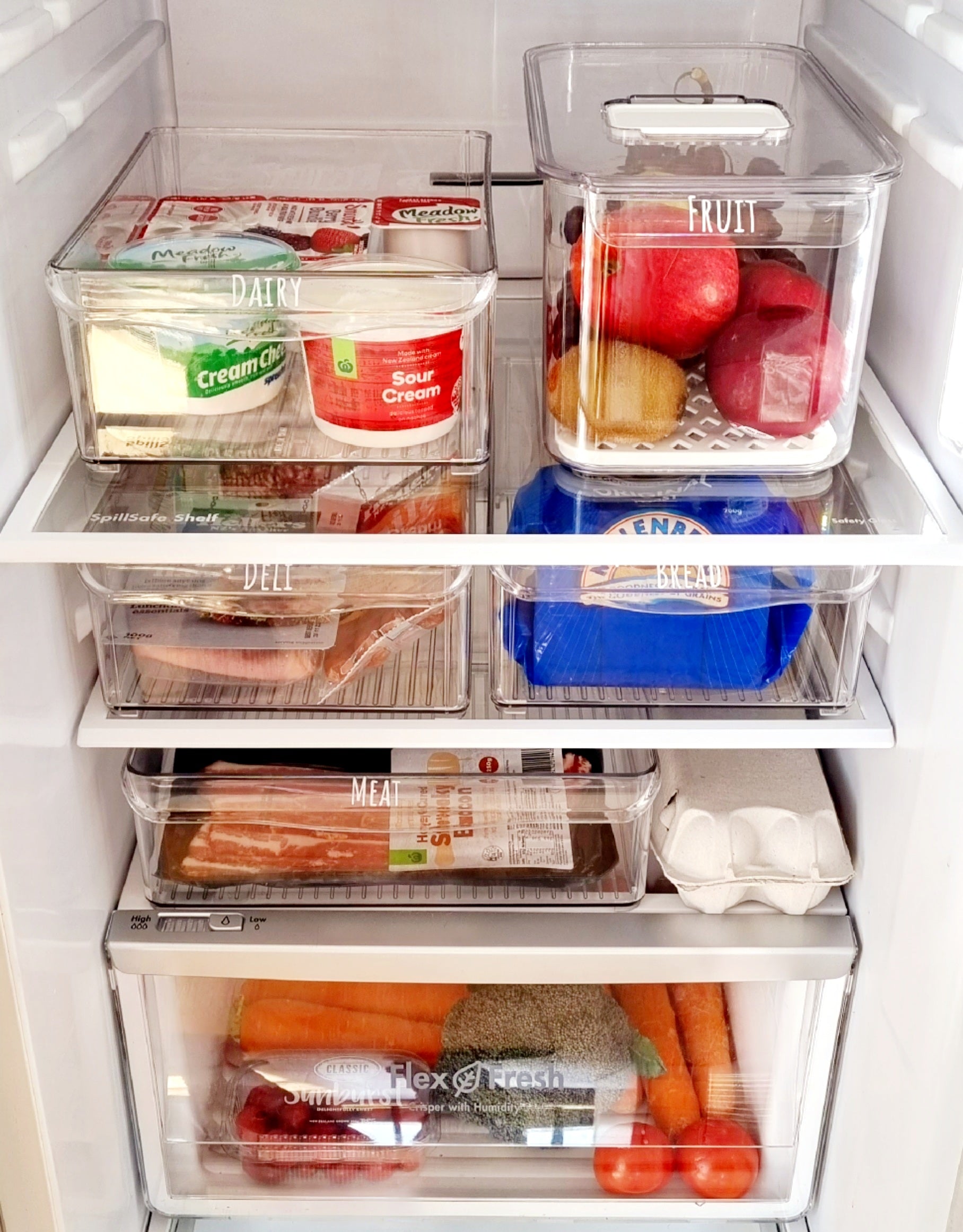 Organised fridge featuring storage containers NZ and fridge organisation solutions for tidy and efficient NZ homes.