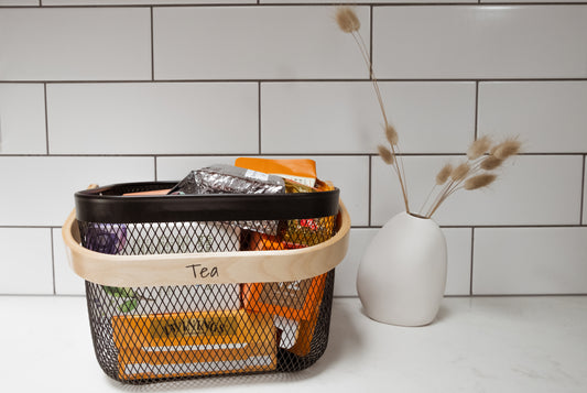 Wire basket with bamboo handle for pantry organisation, kitchen storage, and home organising solutions.