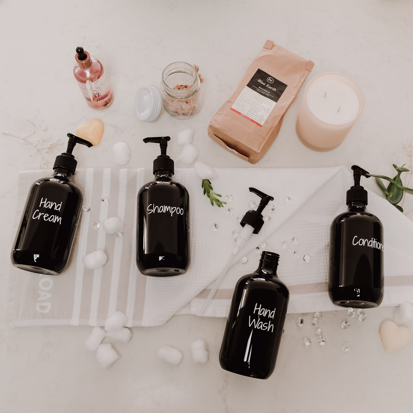 Black plastic liquid dispenser for bathroom storage and organised home essentials in NZ households.