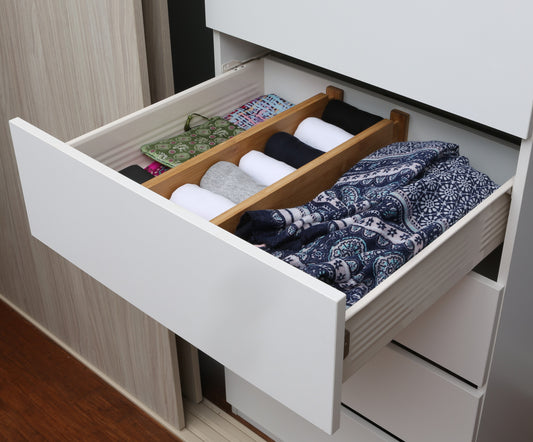 Deep bamboo adjustable drawer divider with spring-loaded ends, perfect for organising deep drawers in the kitchen, wardrobe, or office.
