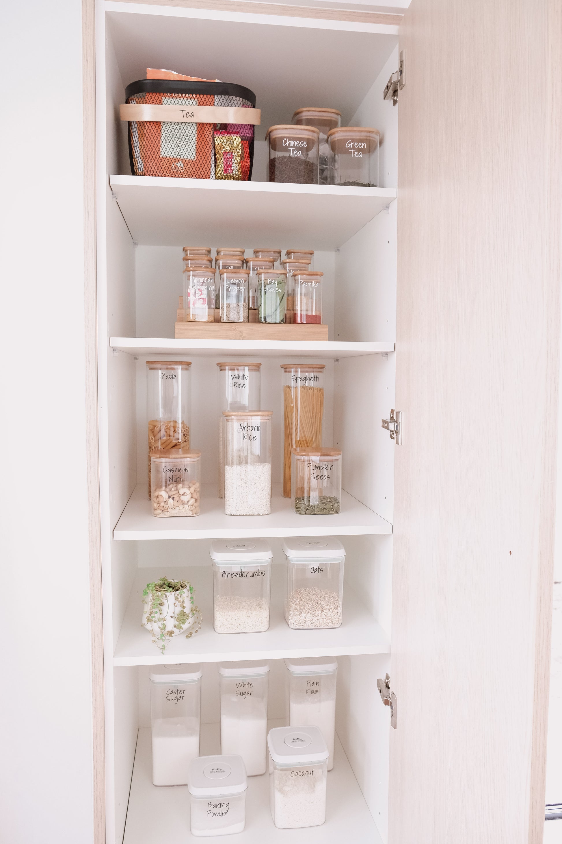Stylish organised pantry showcasing Pretty Pantry Sets with glass containers NZ and kitchen storage solutions.