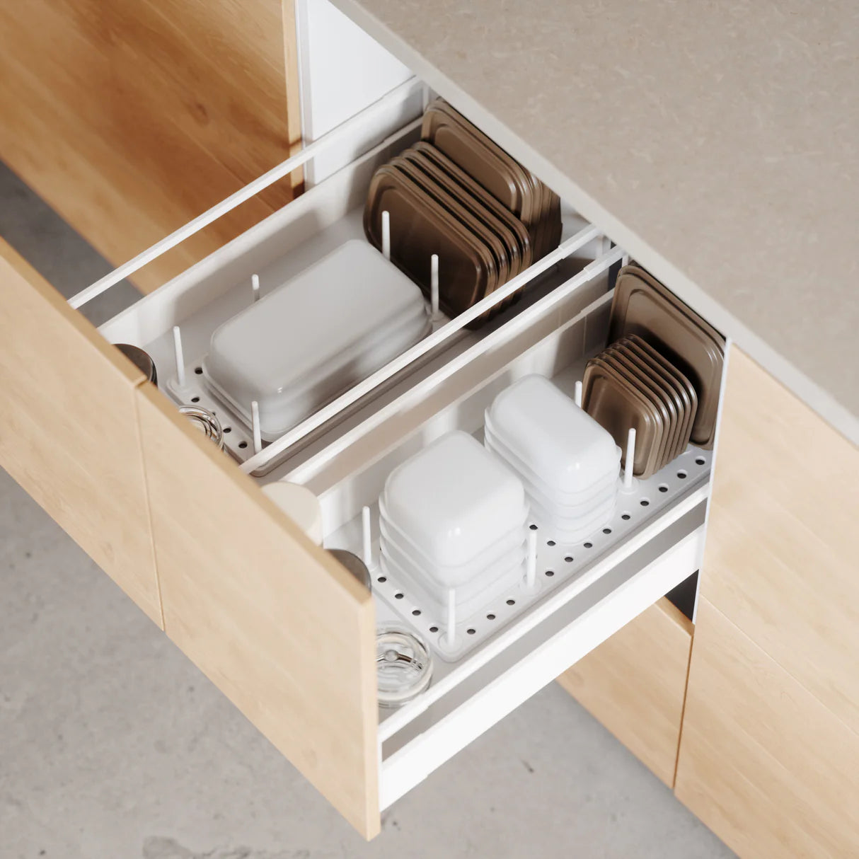 Open kitchen cabinet with organized storage of plates and bowls.