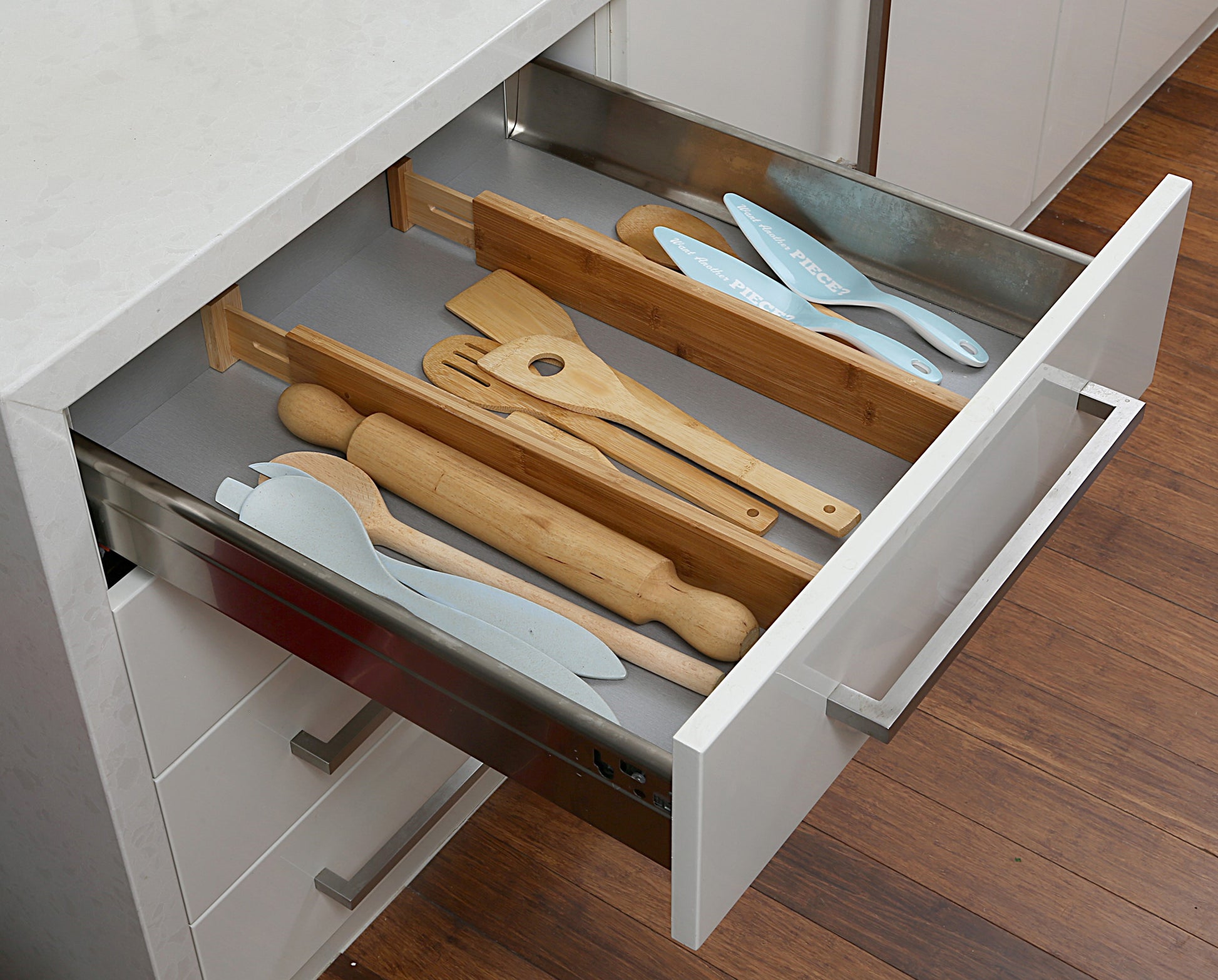 Set of 2 shallow bamboo drawer dividers with adjustable spring-loaded design, ideal for organising small items in shallow drawers.