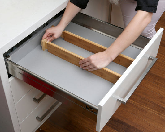 Two adjustable shallow bamboo drawer dividers, perfect for organising cutlery, stationery, or makeup in compact drawers.