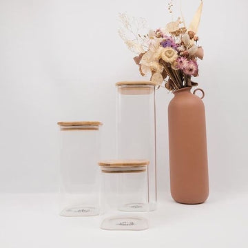 Square glass containers with bamboo lids, perfect for pantry organisation and kitchen storage in NZ.
