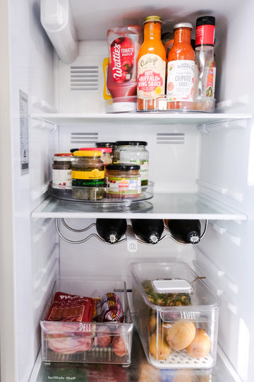 Fridge trays and turntables neatly organising food for easy access, perfect for fridge organisation and home organisation services NZ.

